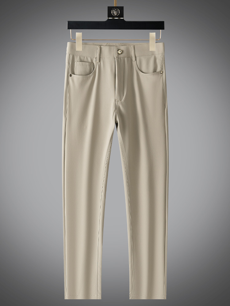 Detailed view of the waistband and pockets on men's refined matte finish beige pants.