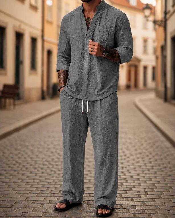 Stylish men's two-piece casual outfit: relaxed fit mandarin collar top & drawstring pants for comfortable summer wear.
