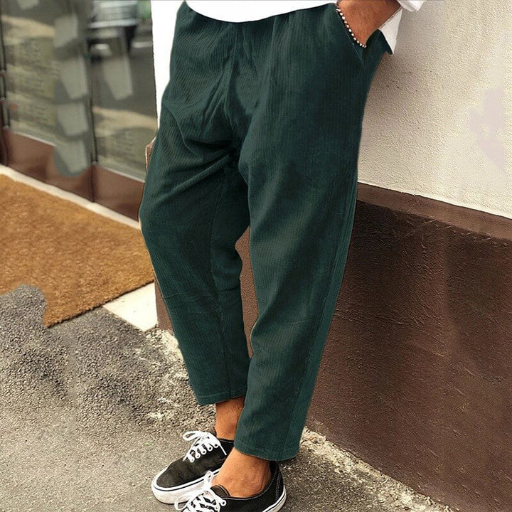 Stylish men's blue corduroy trousers, relaxed fit, durable fabric for versatile fashion