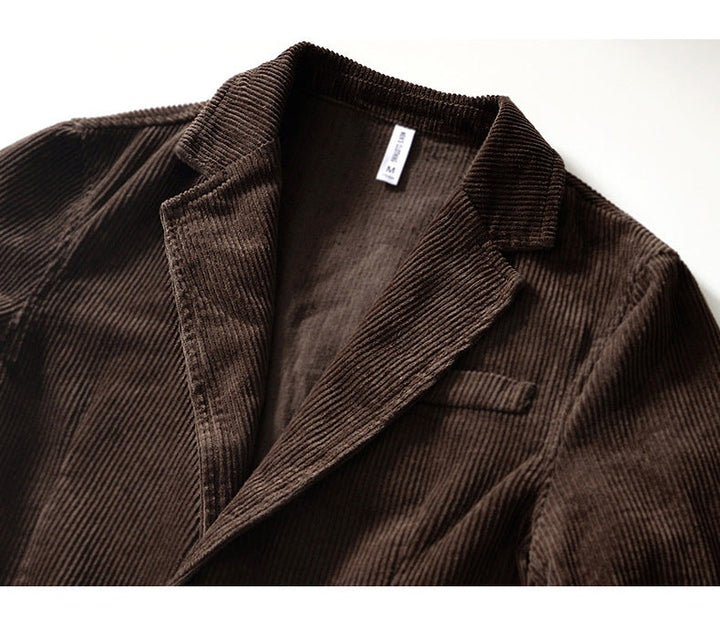 Back view of a men's relaxed fit blue corduroy blazer, showcasing casual style