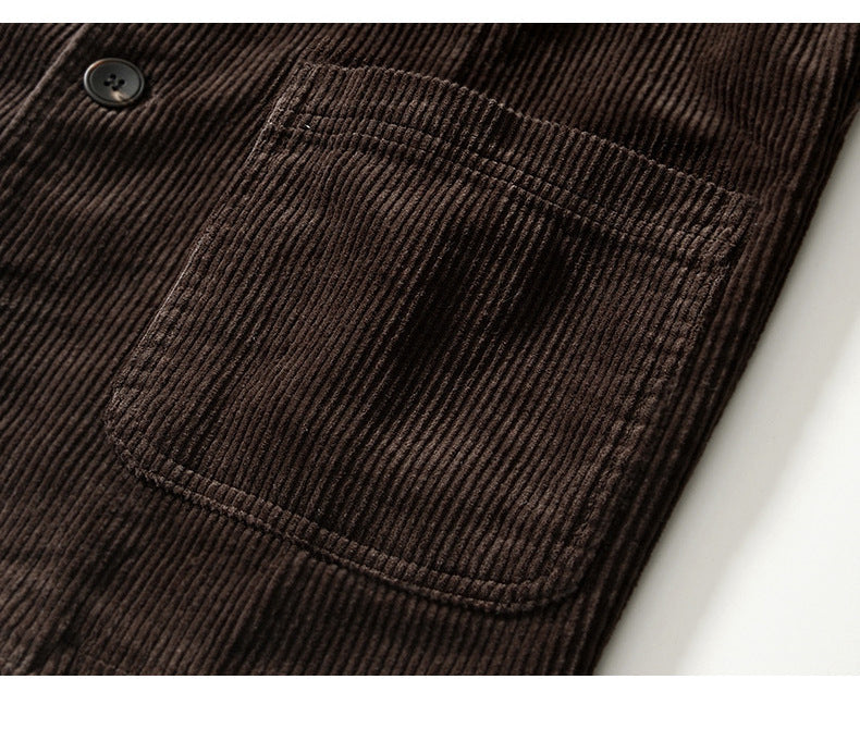Man wearing a relaxed fit brown corduroy blazer layered over a shirt, men's fashion