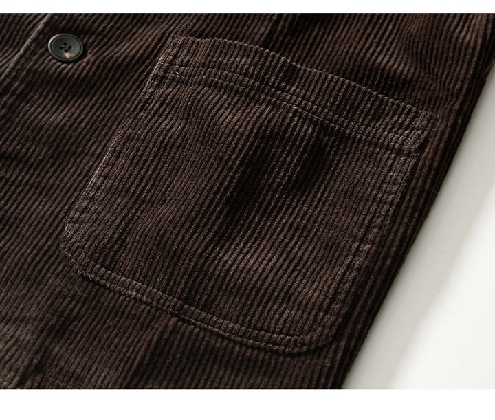 Man wearing a relaxed fit brown corduroy blazer layered over a shirt, men's fashion