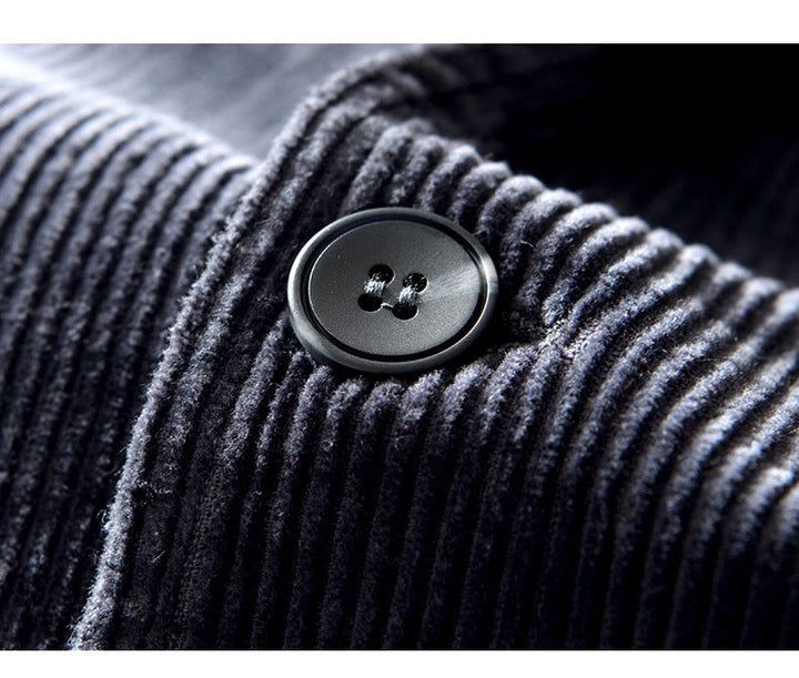 Detail shot of the buttons on a men's gray corduroy blazer, casual jacket