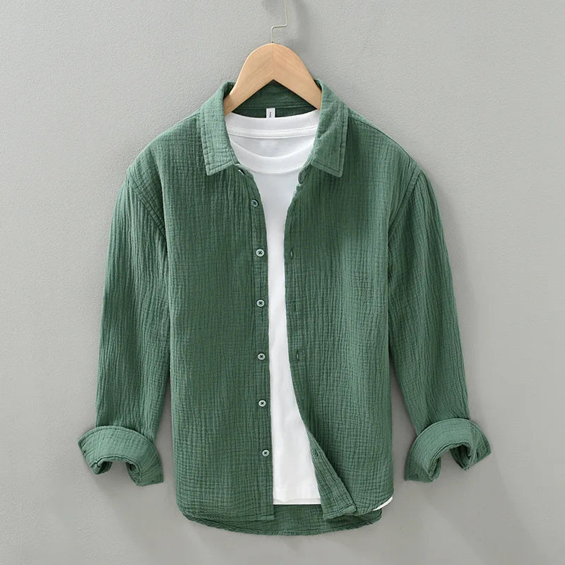 Men's relaxed fit cotton button-down shirt in light blue, perfect for casual summer wear.