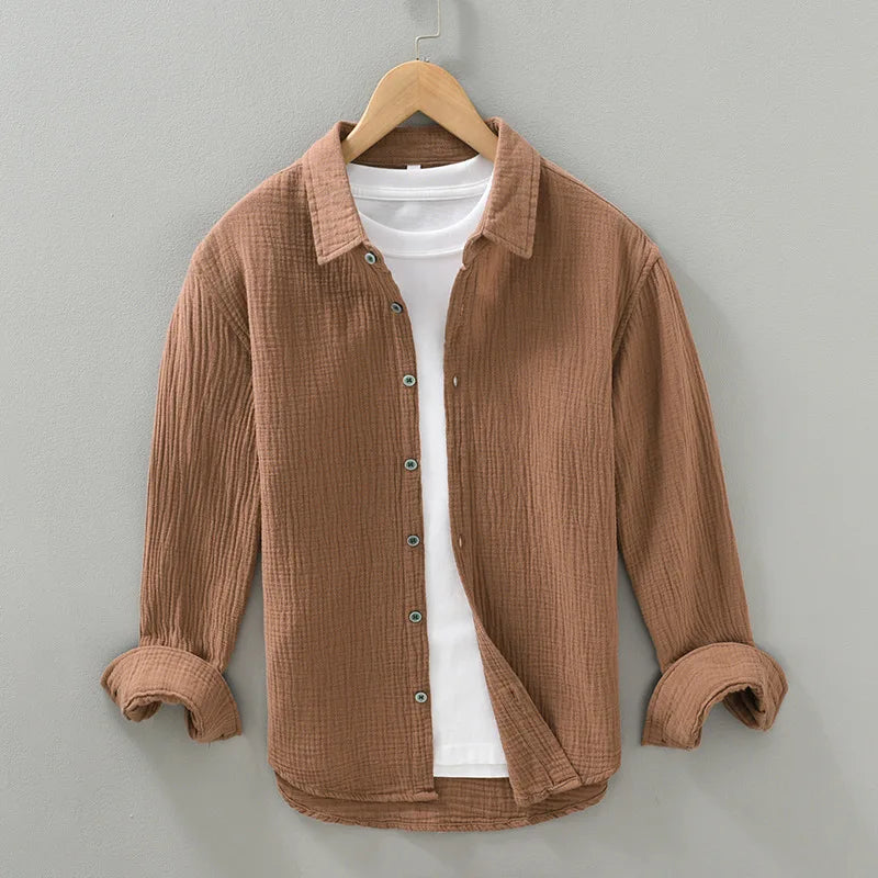 Men's versatile cotton button-down shirt, relaxed fit, shown unbuttoned over a t-shirt.