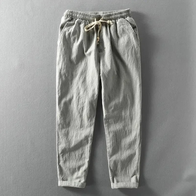 Breathable men's casual linen jogger pants, ideal for summer. Features a relaxed fit and practical drawstring