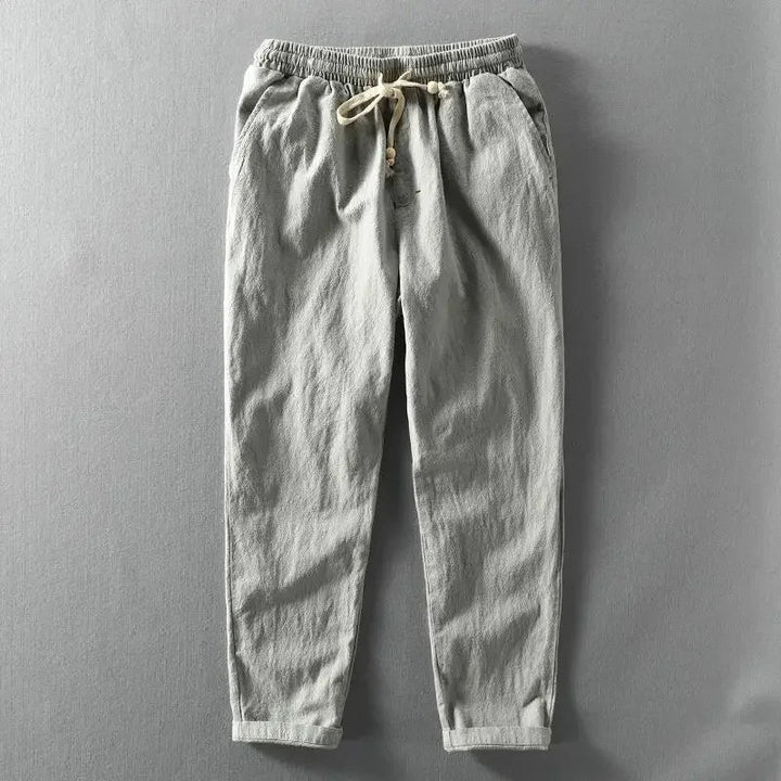 Breathable men's casual linen jogger pants, ideal for summer. Features a relaxed fit and practical drawstring