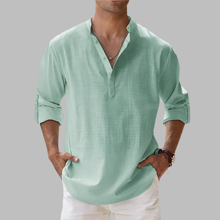 Men's casual long sleeve button-down shirt with a relaxed fit. Ideal summer shirt for warm weather & vacation.