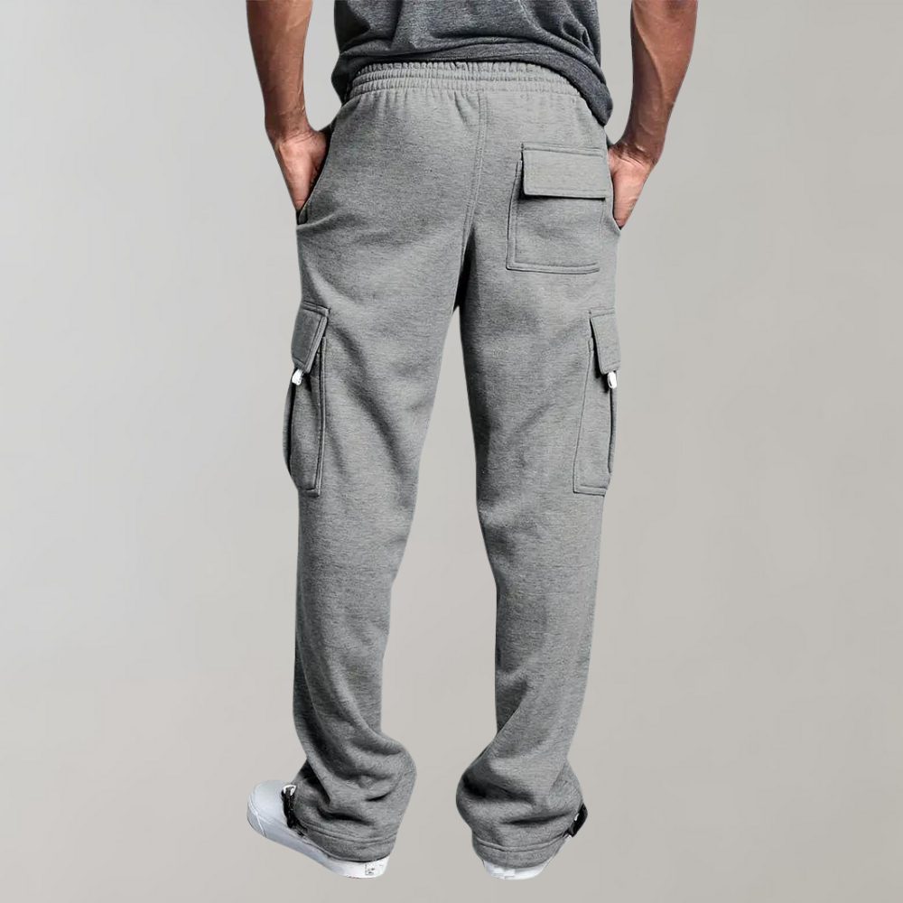 Close-up of grey men's relaxed fit tactical cargo pants with multiple pockets for utility.