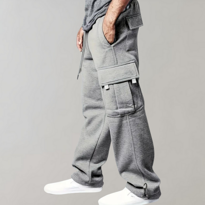 Model wearing black men's relaxed fit tactical cargo pants for a modern streetwear look.