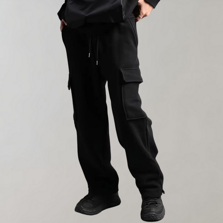 Side view of grey men's relaxed fit tactical cargo pants, showing a spacious and practical design.