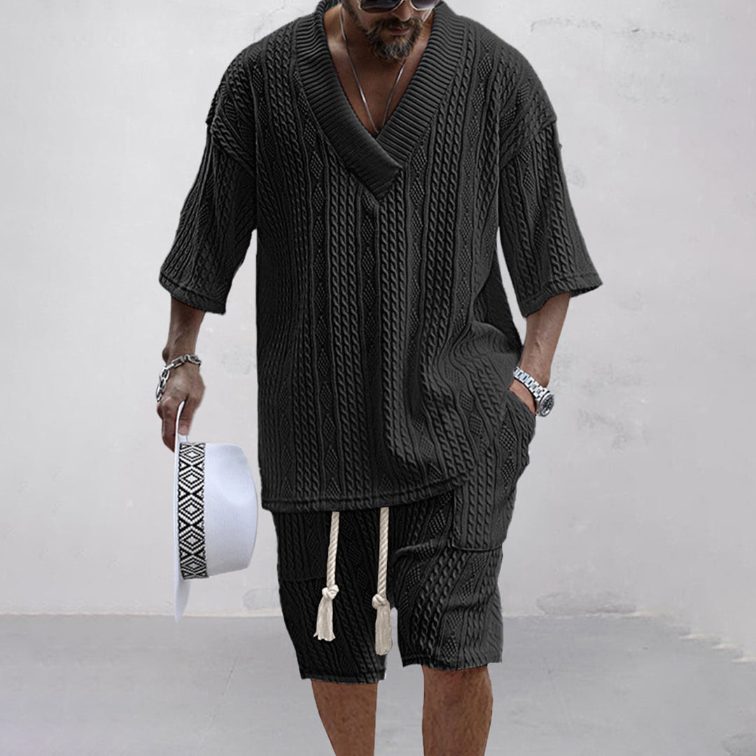 Detail of men's relaxed V-neck shirt and matching shorts. Comfortable two-piece lounge wear for men.