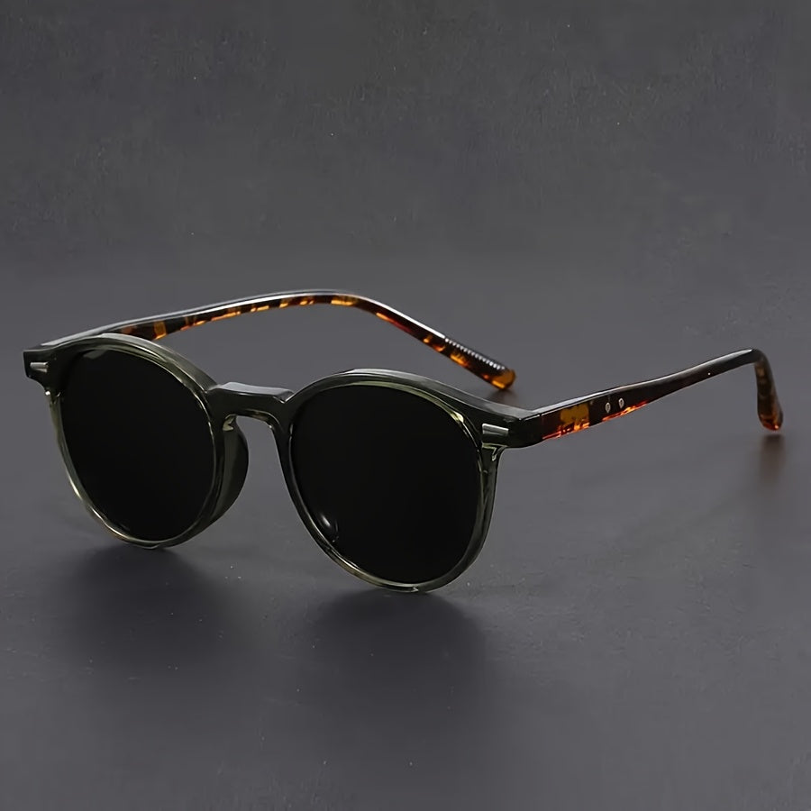 Sleek men's round frame sunglasses in solid black. Lightweight & classic retro shades for stylish men.