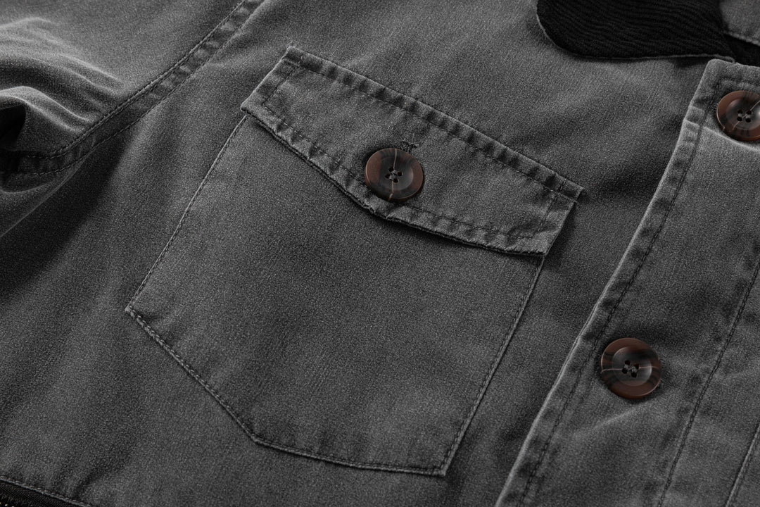 Internal lining detail of the men's black canvas jacket, showing craftsmanship and quality.