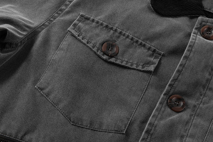 Internal lining detail of the men's black canvas jacket, showing craftsmanship and quality.