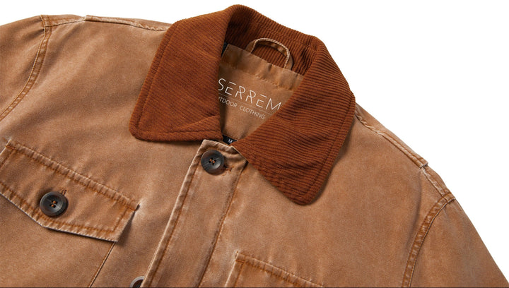Black canvas jacket laid flat, front and back view, highlighting the corduroy collar and practical design.