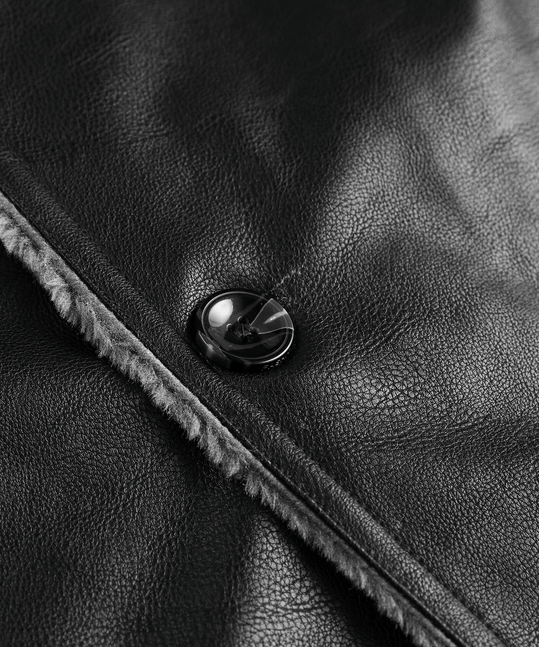 Lifestyle shot of the men's rugged black winter coat in a snowy outdoor environment