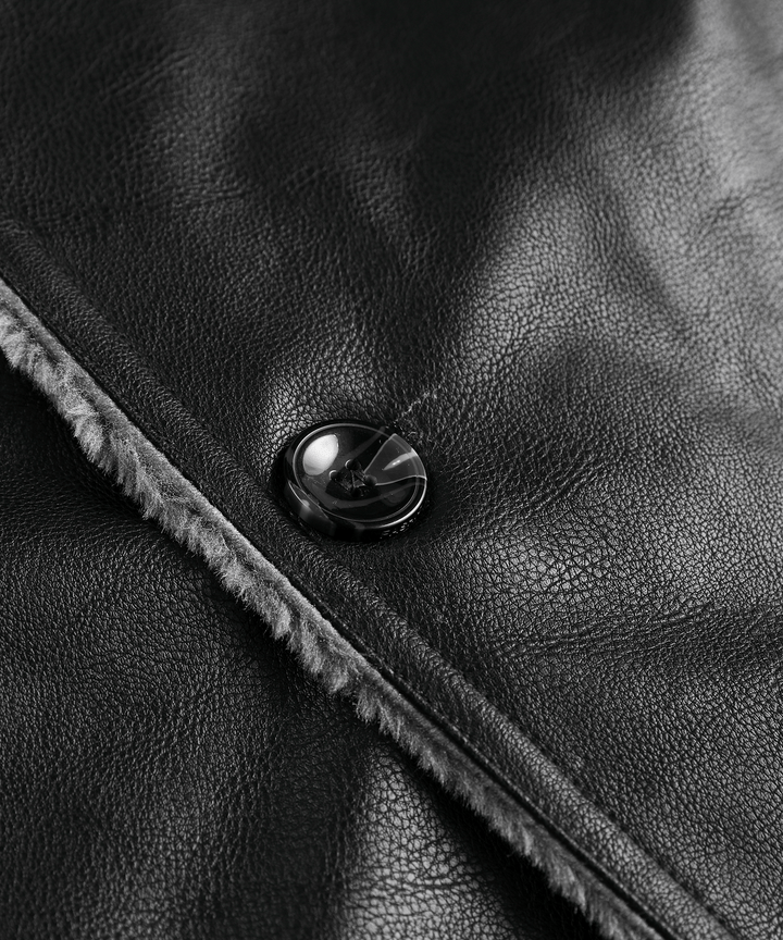 Lifestyle shot of the men's rugged black winter coat in a snowy outdoor environment