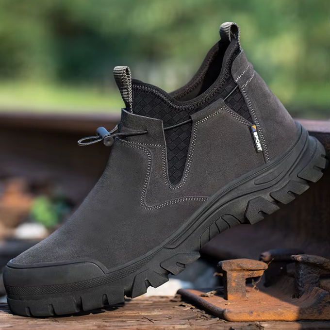 Close-up of a men's black steel-toe work boot, slip-on style, casual yet safe