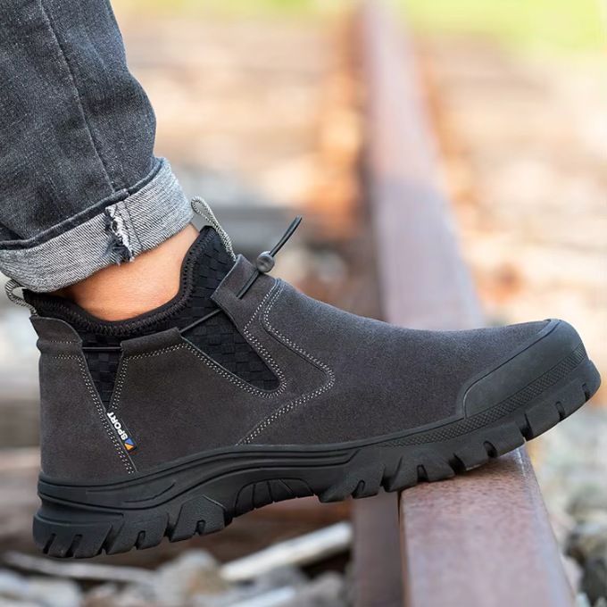 Pair of men's steel-toe work boots in dark brown, durable safety footwear for men