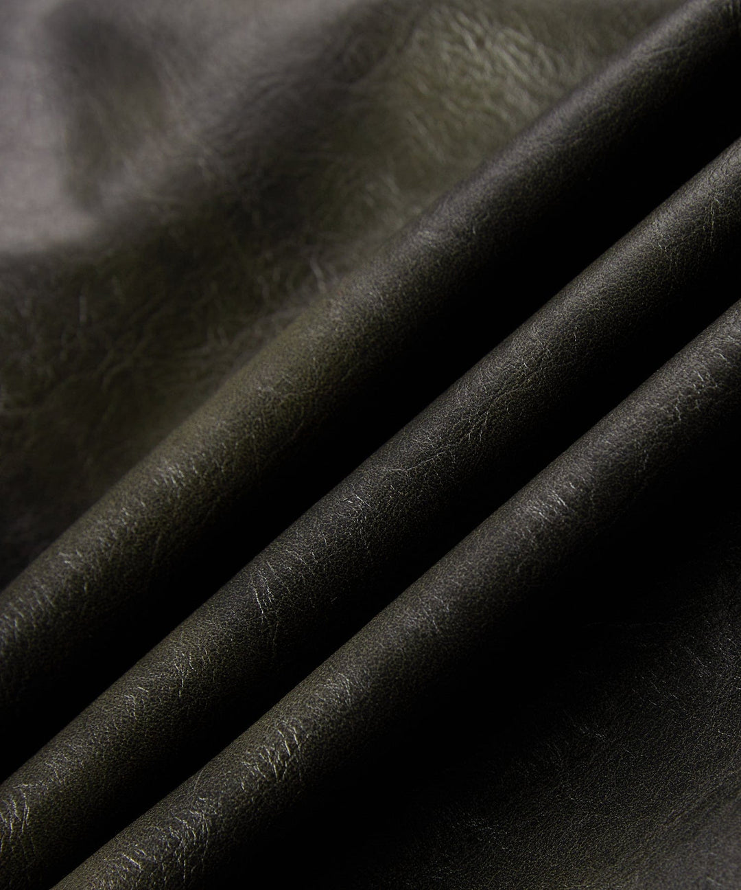 Close-up of the sleeve cuff and buttons on the men's casual faux leather jacket