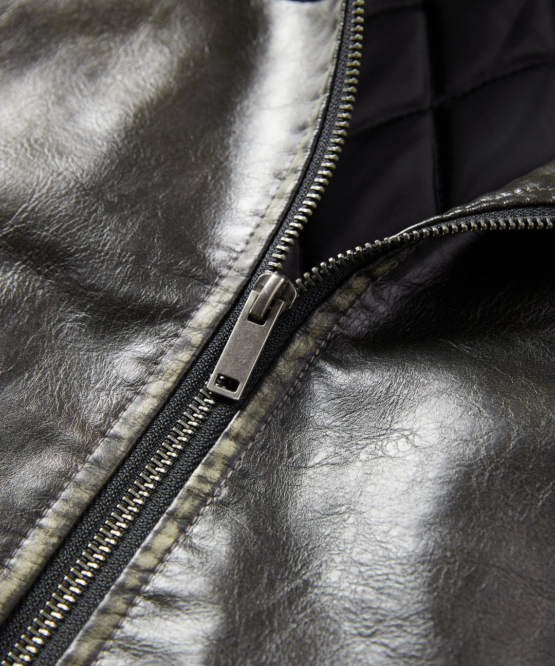 Full-length shot of a man wearing the Rustic Edge Faux Leather Jacket casually