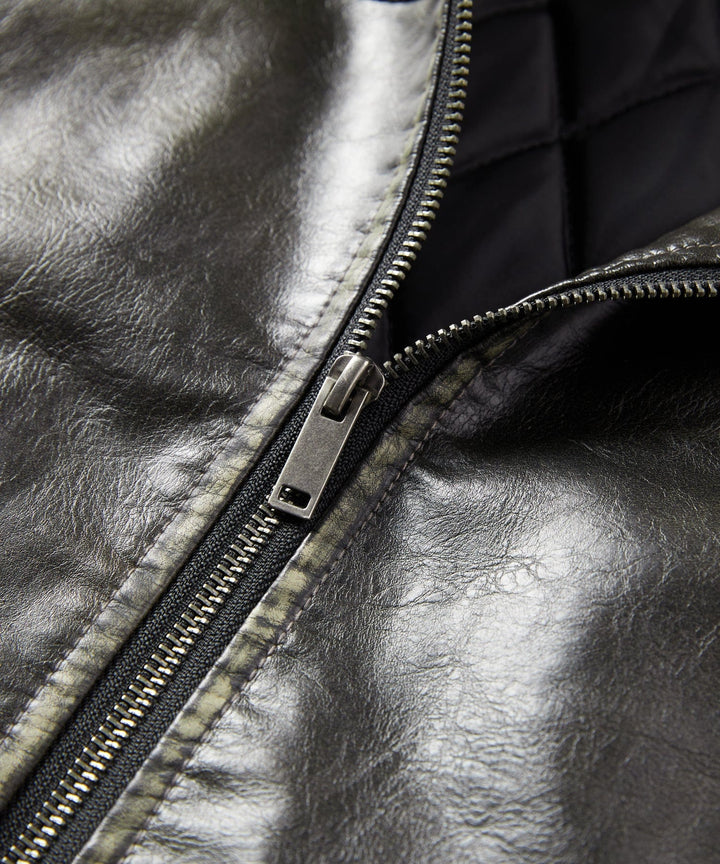 Full-length shot of a man wearing the Rustic Edge Faux Leather Jacket casually