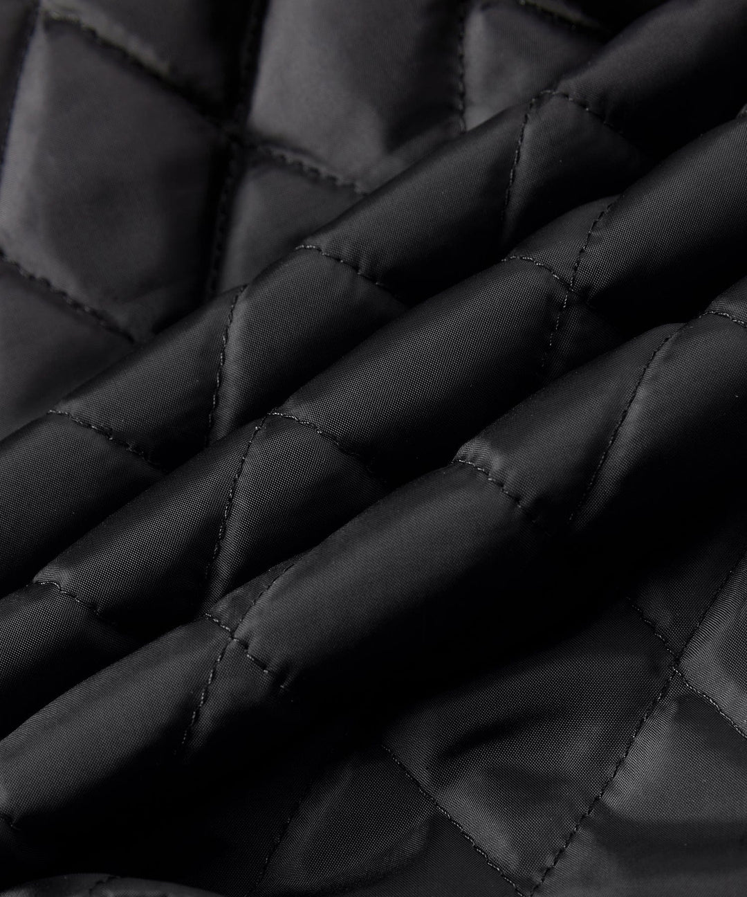 Rustic Edge Faux Leather Jacket draped over a chair, highlighting its texture