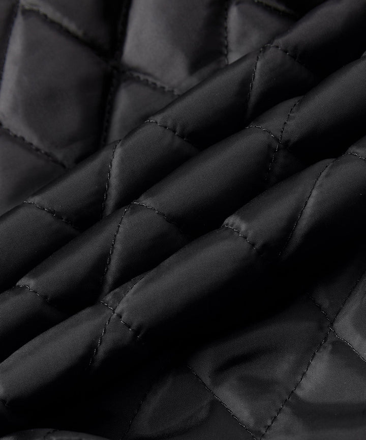 Rustic Edge Faux Leather Jacket draped over a chair, highlighting its texture