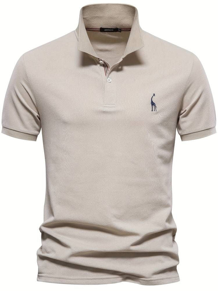 Front view of men's short sleeve golf polo shirt with a playful embroidered giraffe. Essential men's casual wear.