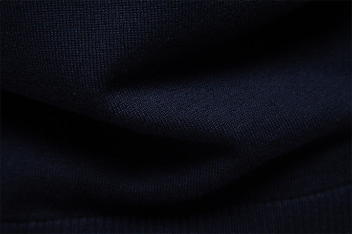 lifestyle shot of man relaxing in a Siena half-zip cotton blend longsleeve sweater
