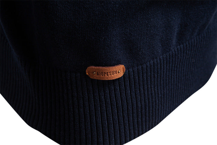 Close-up of the striped knit pattern on a men's Siena half-zip pullover sweater