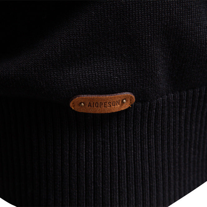 Siena half-zip knit sweater laid flat, highlighting the striped pattern and material