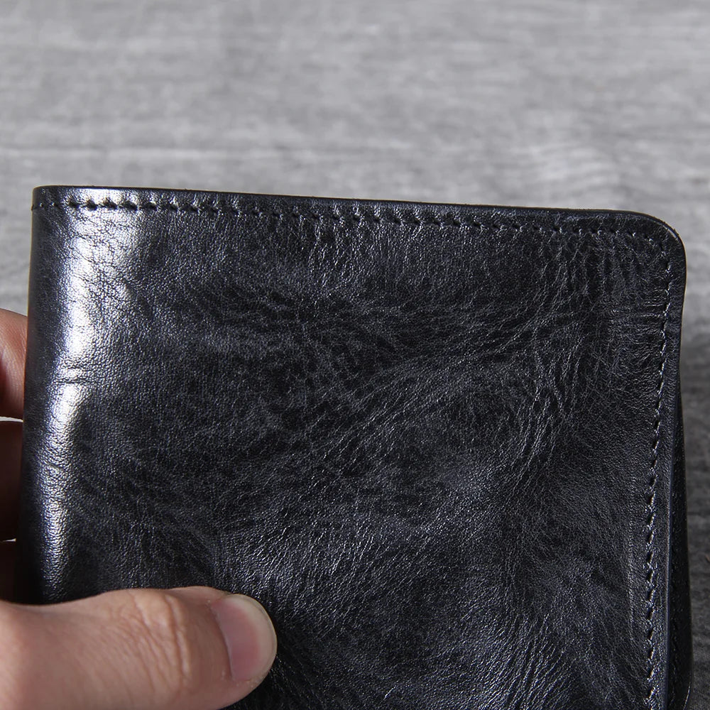 Men's leather wallet with a secure snap closure for the coin pouch.