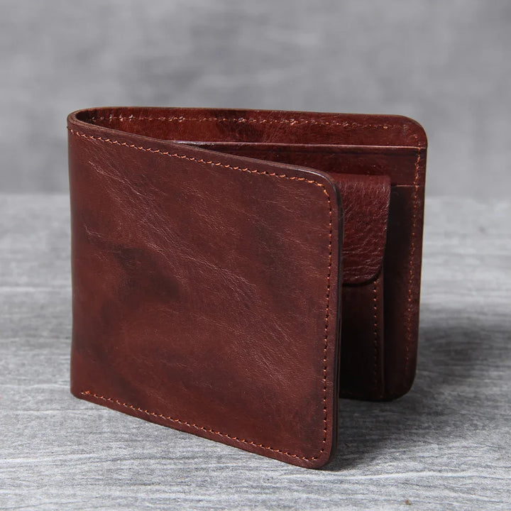 Front view of a dark brown men's bifold leather wallet, showcasing its slim design.