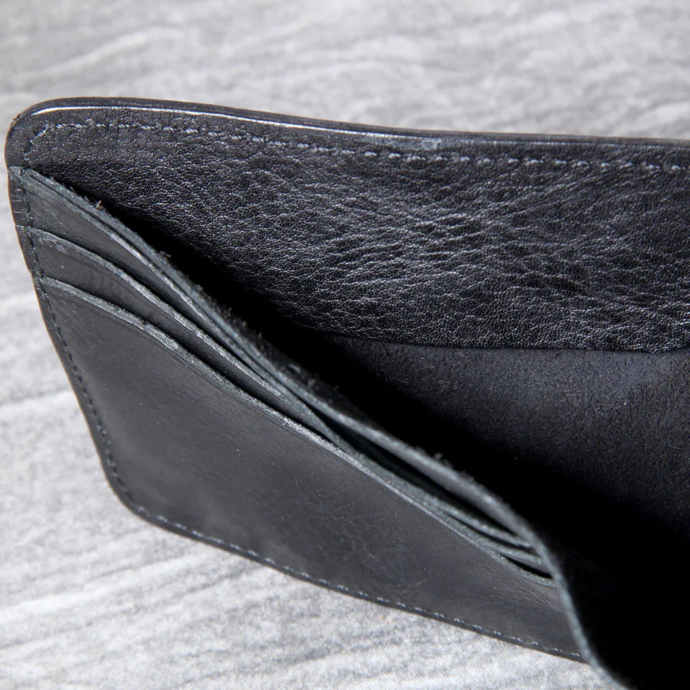 Men's slim bifold wallet crafted from premium cowhide leather, a timeless gift.