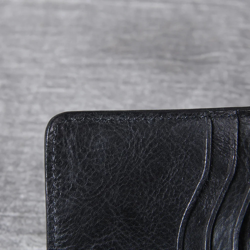 An elegant men's leather bifold wallet with a smooth finish, perfect for any occasion.