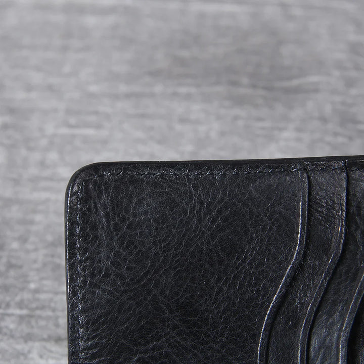 An elegant men's leather bifold wallet with a smooth finish, perfect for any occasion.