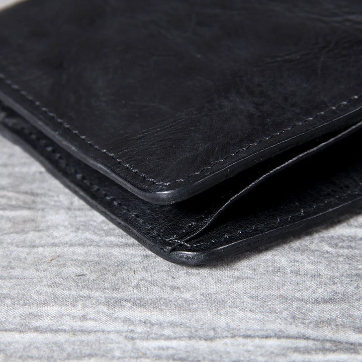 Men's slim bifold wallet designed for minimalist everyday carry, high-quality leather.