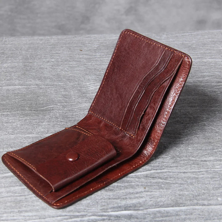 Open men's slim leather wallet revealing multiple card slots and a coin pouch.