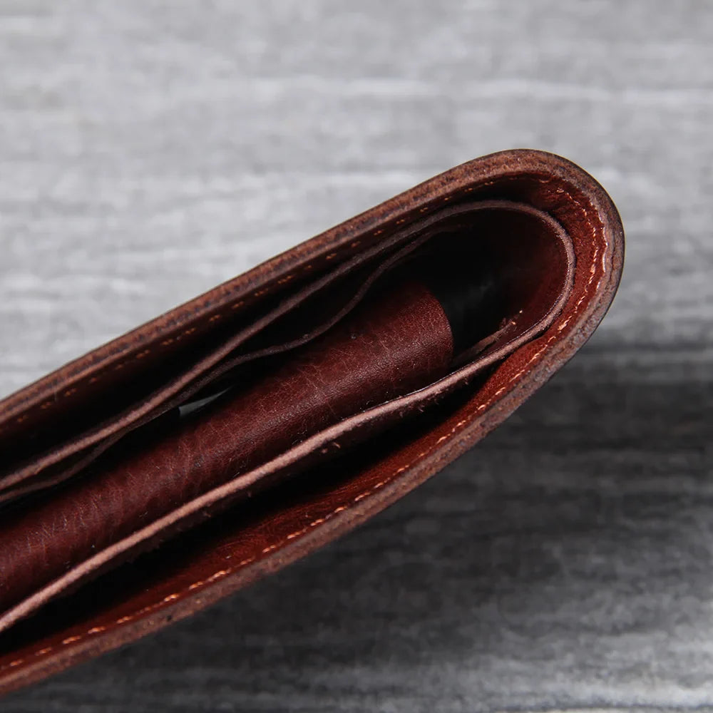 Black cowhide leather bifold wallet for men, a sleek and functional everyday accessory.
