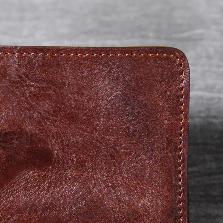 Interior view of a men's slim leather wallet with ample card holder space and pouch.
