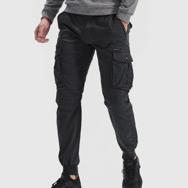 Stylish men's utility cargo joggers, slim fit with tapered leg. Perfect for streetwear, activewear, or casual comfort.