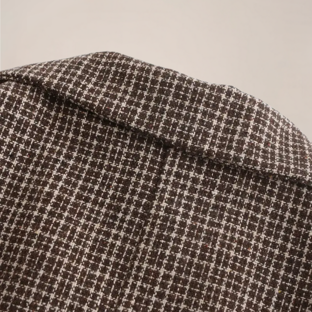 Close-up of a men's check pattern slim fit blazer, highlighting the quality fabric and tailored design.