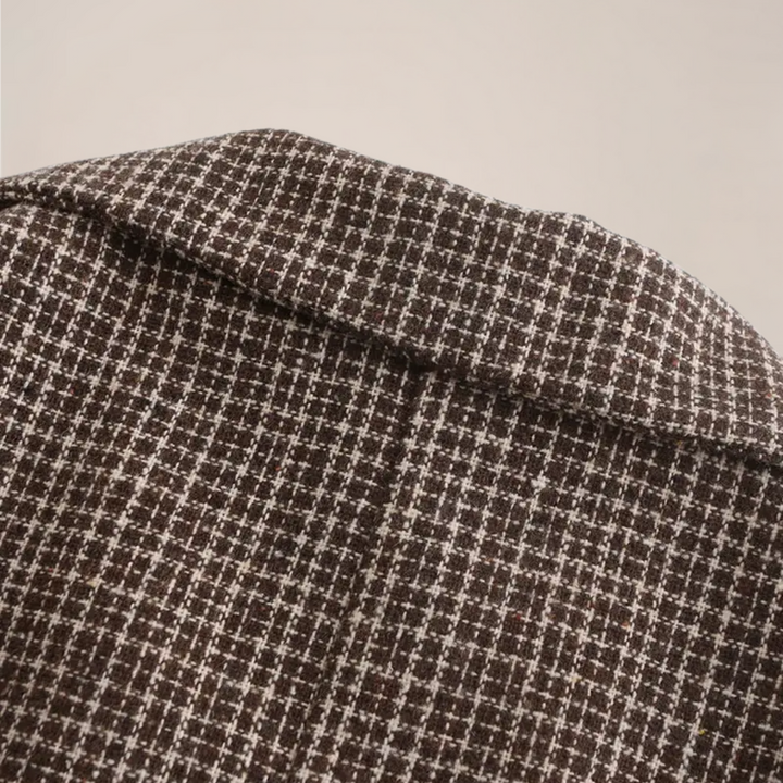 Close-up of a men's check pattern slim fit blazer, highlighting the quality fabric and tailored design.
