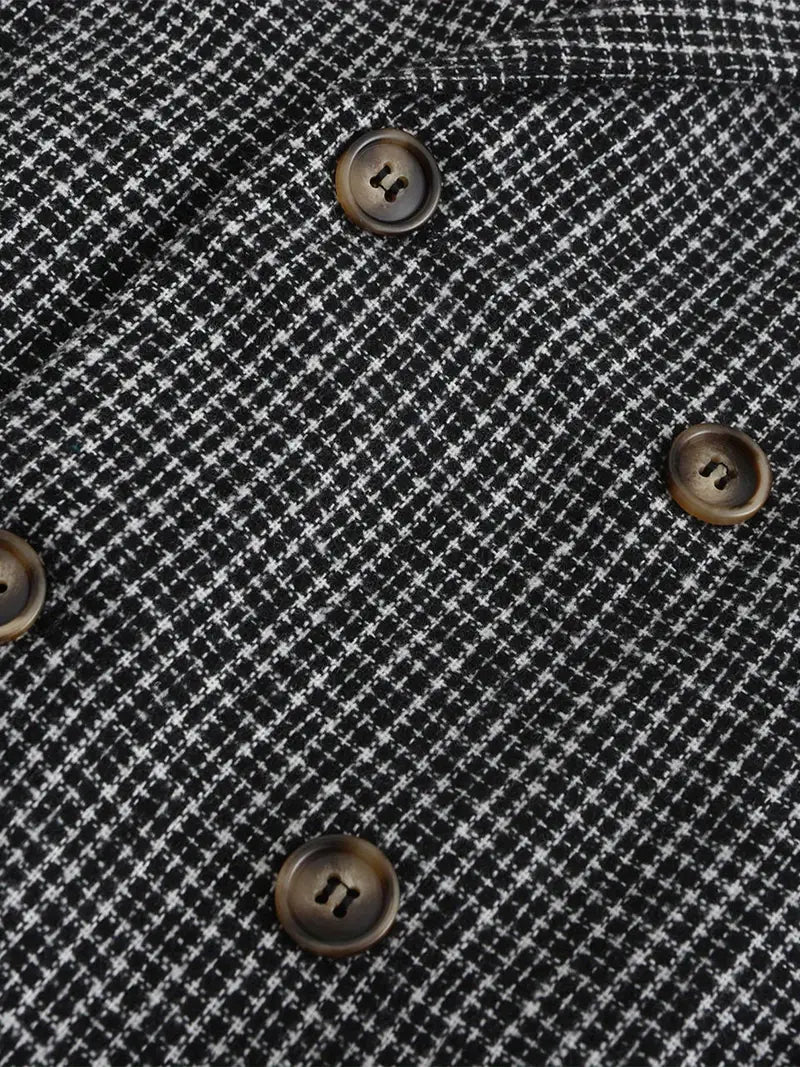 Close-up of a men's check blazer fabric, highlighting the pattern & slim fit design for smart casual wear.