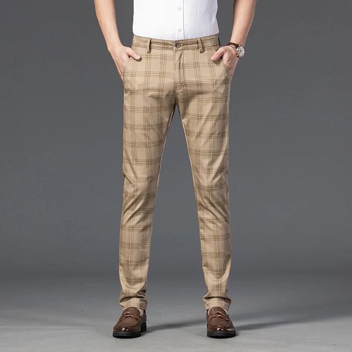 Close-up of the subtle plaid pattern on men's slim fit dress pants, highlighting fabric detail.