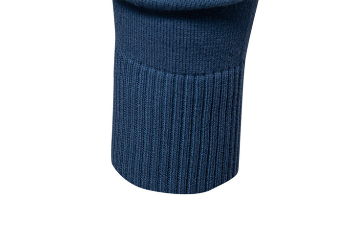 Folded men's ribbed V-neck pullover sweater, highlighting its quality knit