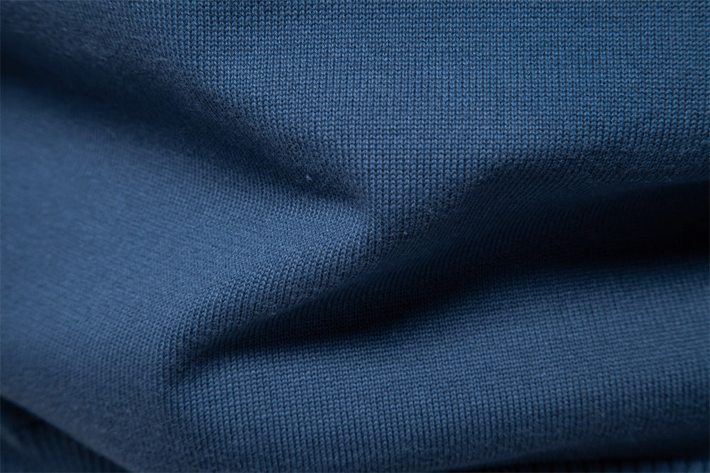 Back view of a men's slim fit ribbed V-neck sweater, showing seamless design
