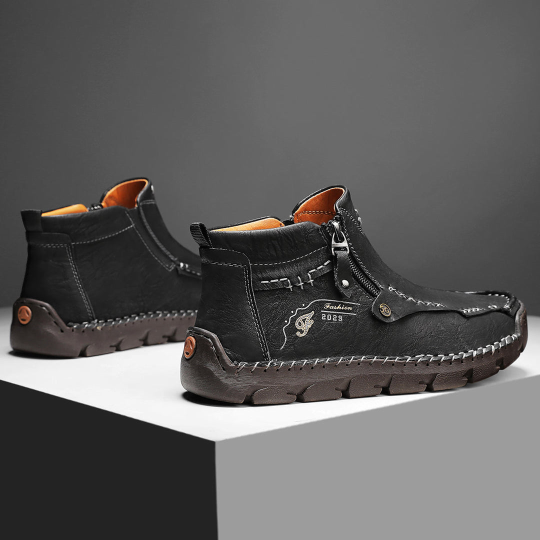 Pair of Men's black outdoor tooling boots, breathable design, ready for adventure, zipper entry